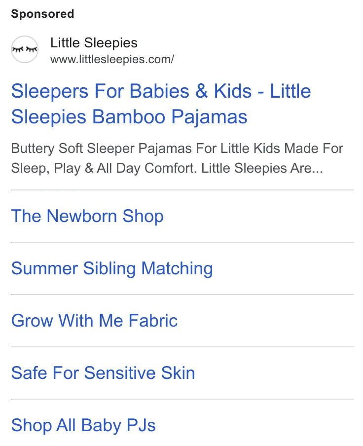 Little Sleepies Google Ads Transparency Center - 'Sleepers For Babies & Kids' broad search result with multiple sitelinks across age and product categories