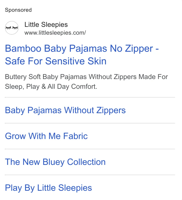 Little Sleepies Google search ad - 'Baby Pajamas No Zipper - Safe For Sensitive Skin' and 'Grow With Me Fabric' feature-based headlines